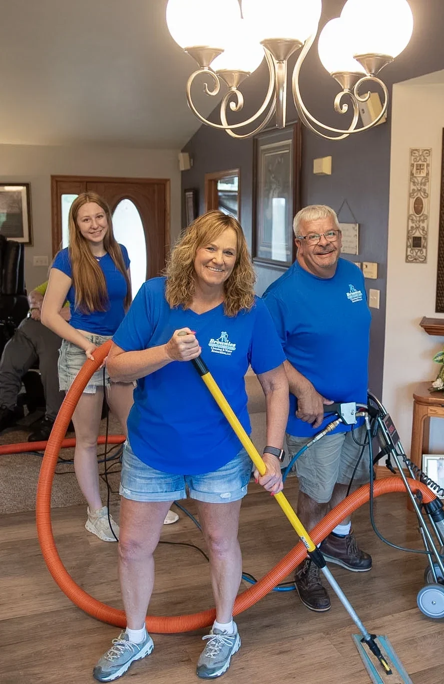 Brownie's carpet cleaning crew posing in the middle of work